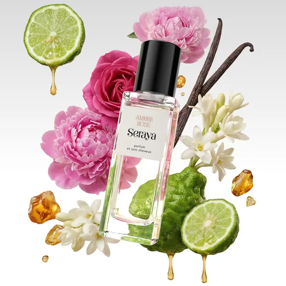 Composition Seraya Ambre Rose avec bergamote, roses, jasmin et ambre en suspension autour du flacon