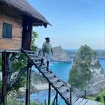 Reda, founder of Turapura, photographed on a cliffside walkway
