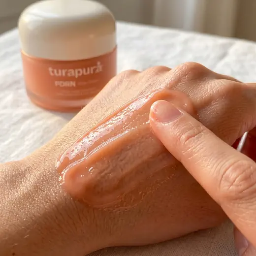 Turapura cream spread across the back of a hand, absorption content by Mira Visions